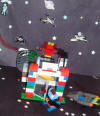 Meep and Beep come from Uranus. They are trying to see what Saturn is like by looking through an Exit port.
